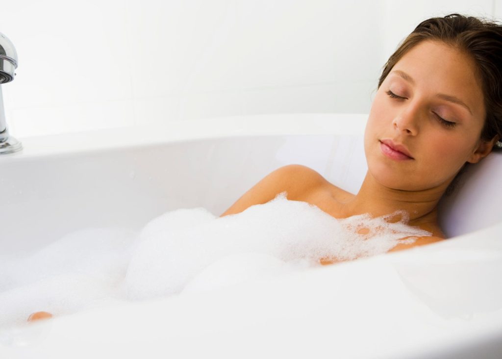 rest: mom enjoying bubble bath with eyes closed