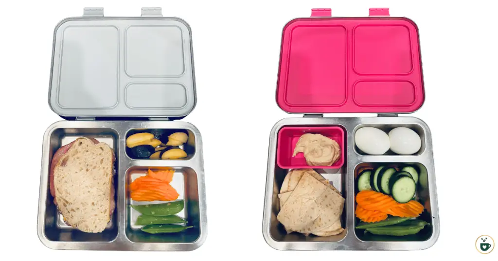 2 bento lunchboxes for kids. First a classic sandwich, plums, and veggies. Second is pita bread with hummus, hard boiled eggs, and assorted vegetables.